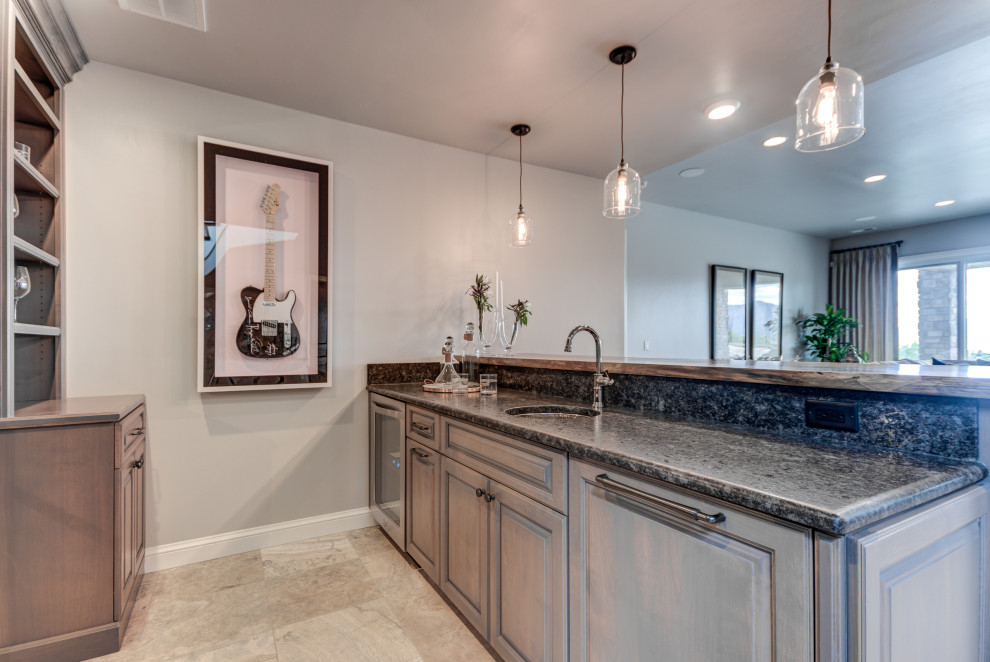 Example of a transitional home design design in Denver