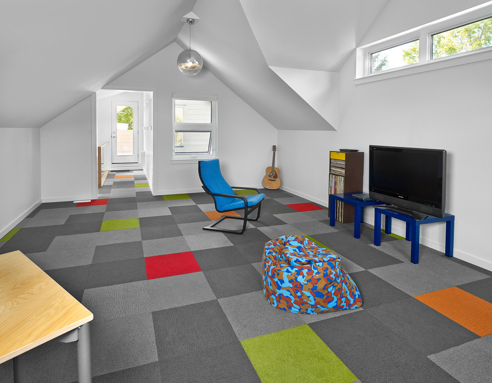 Photo of a large contemporary gender-neutral kids' playroom in Edmonton with white walls, carpet and multi-coloured floor.