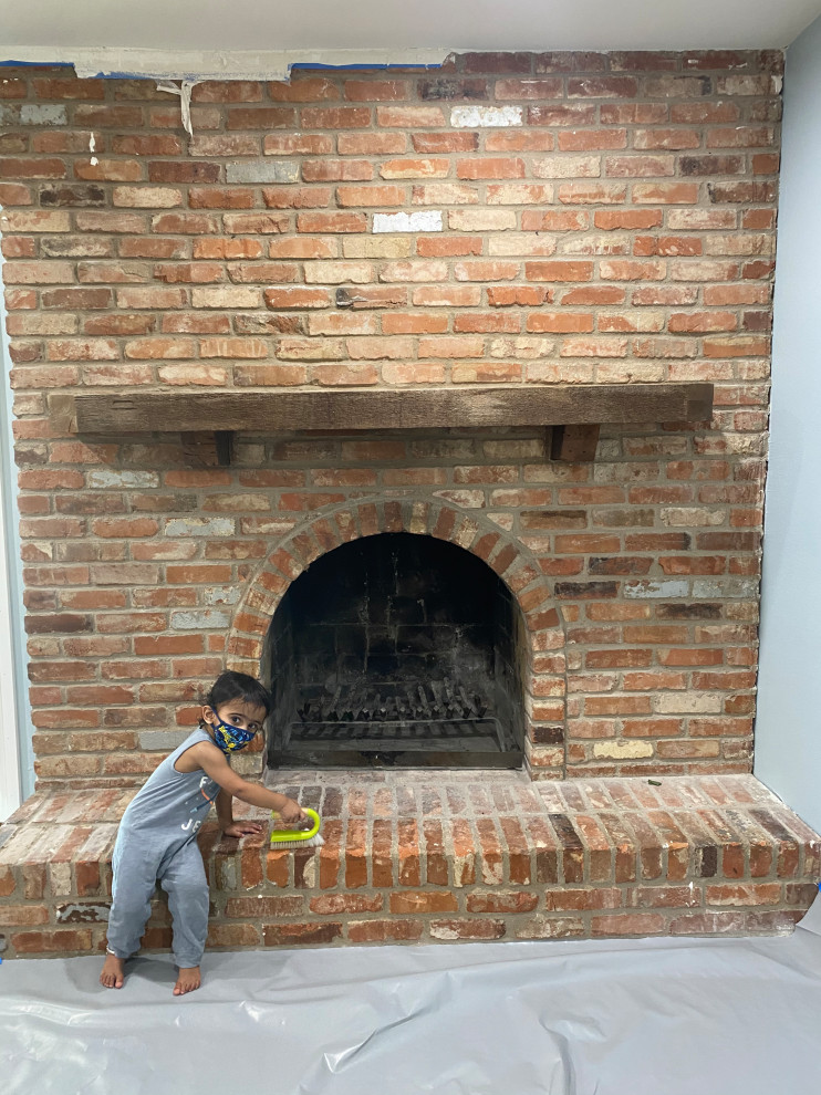 How do I fix the gap between brick fireplace and wall?