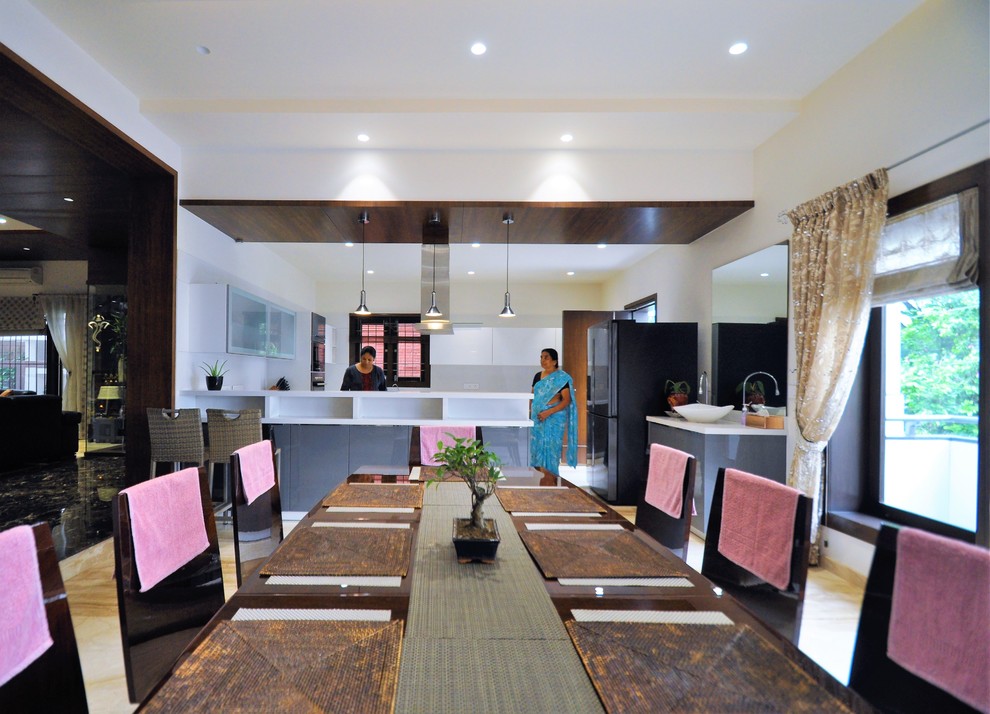 Design ideas for a contemporary dining room in Bengaluru.