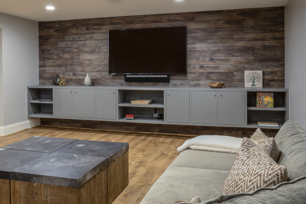 Inspiration for a huge cottage underground laminate floor and beige floor basement remodel with gray walls