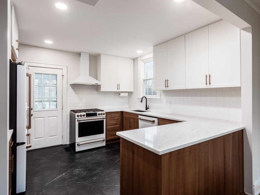 Small transitional u-shaped eat-in kitchen photo in Columbus with shaker cabinets, quartz countertops and white backsplash