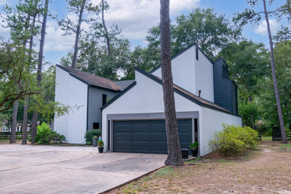 Example of a huge trendy gray two-story concrete fiberboard and clapboard exterior home design in Houston with a shingle roof and a black roof