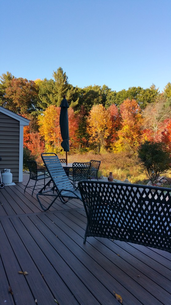 Mid-sized transitional backyard deck photo in Boston