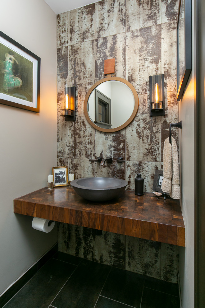 Small traditional cloakroom in Kansas City with dark wood cabinets, multi-coloured tiles, porcelain tiles, a vessel sink and a floating vanity unit.