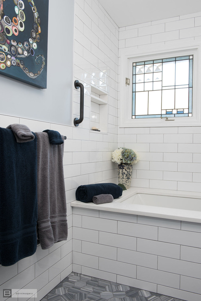 Inspiration for a mid-sized modern kids bathroom in Boston with furniture-like cabinets, blue cabinets, a shower/bathtub combo, white tile, blue walls, marble floors, an undermount sink, engineered quartz benchtops, grey floor, a shower curtain and white benchtops.