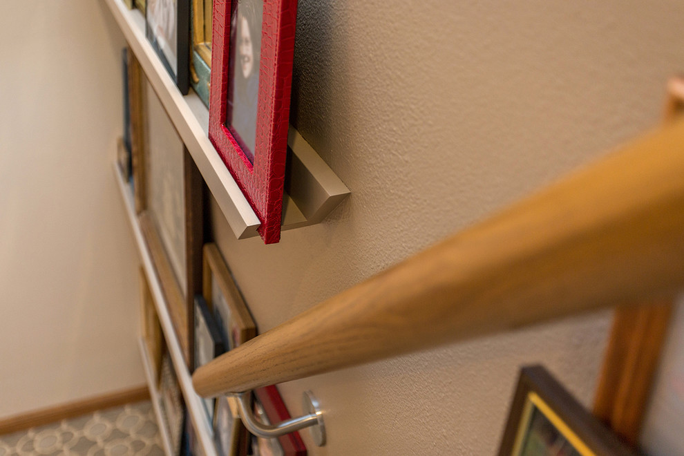 Inspiration for a mid-sized transitional staircase remodel