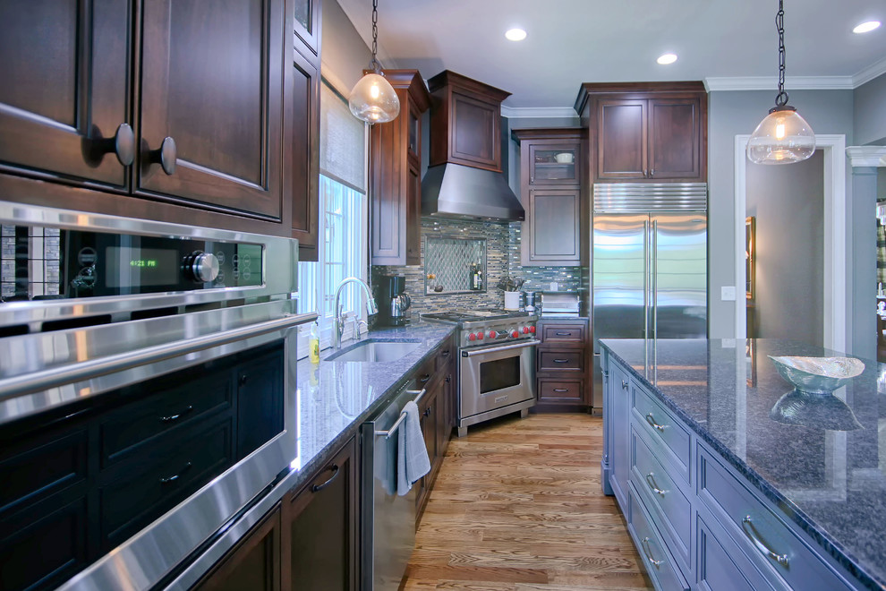 Large transitional medium tone wood floor eat-in kitchen photo in Charlotte with an undermount sink, flat-panel cabinets, stainless steel appliances and an island
