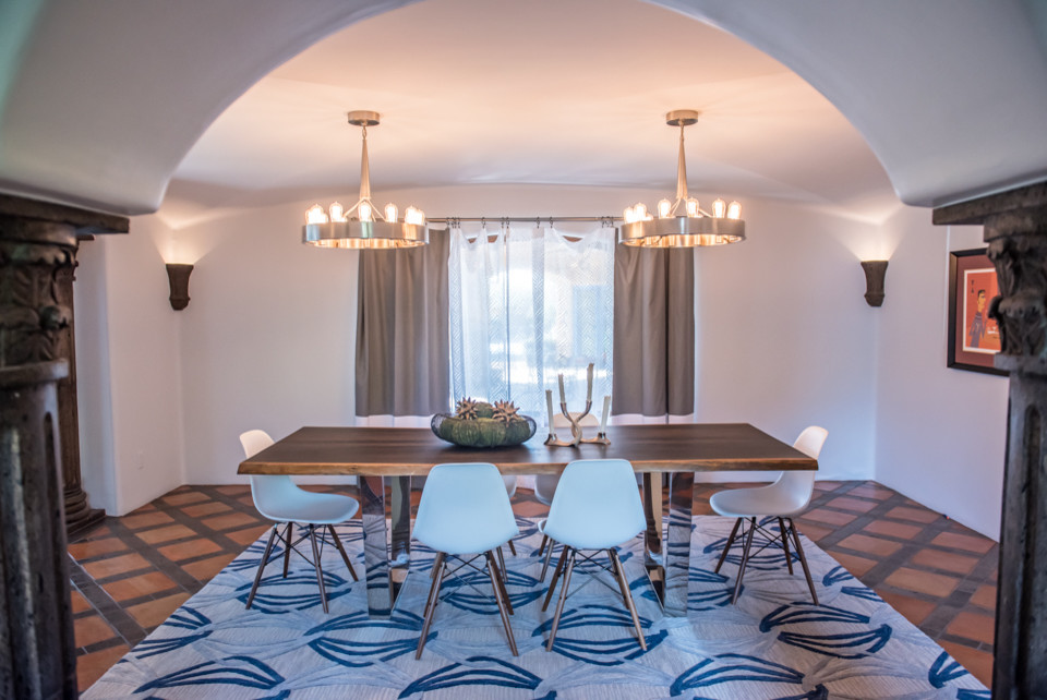 Inspiration for a large transitional terra-cotta tile enclosed dining room remodel in Phoenix with white walls