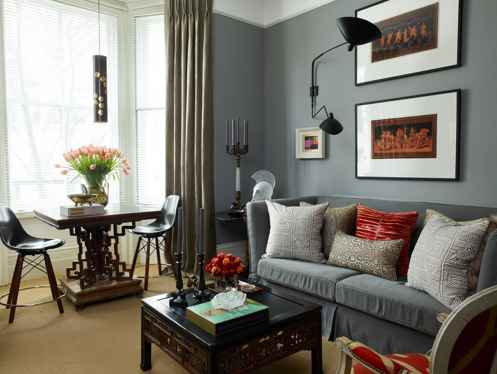 This is an example of an eclectic formal living room in London with grey walls, carpet and brown floor.