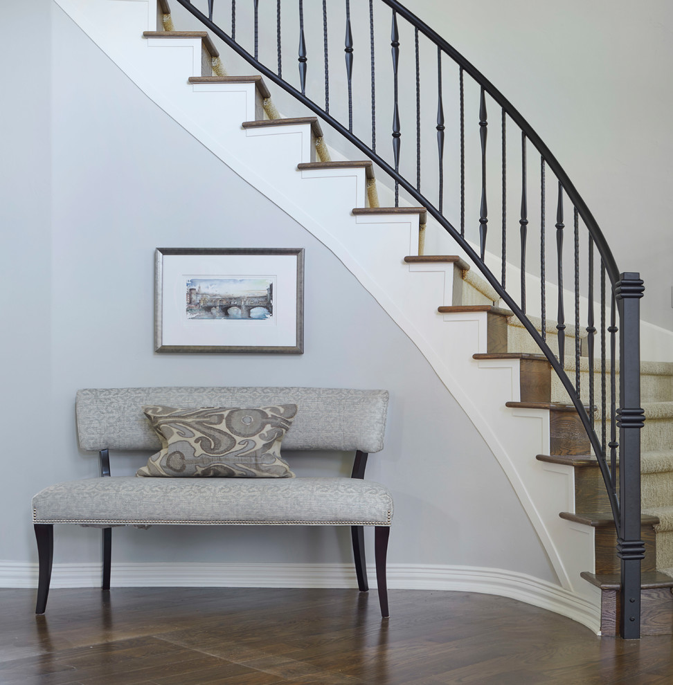 Example of a mid-sized transitional medium tone wood floor and brown floor foyer design in Denver with gray walls