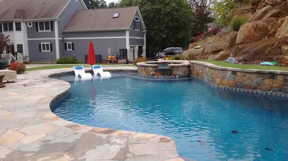 Inspiration for a rustic pool remodel in New York