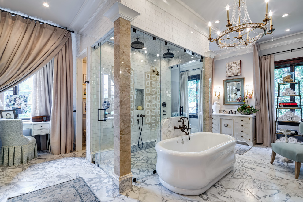 Inspiration for a traditional master bathroom in Atlanta with a freestanding tub, white tile, multi-coloured tile, subway tile, marble floors, a double shower, grey walls, a hinged shower door and flat-panel cabinets.