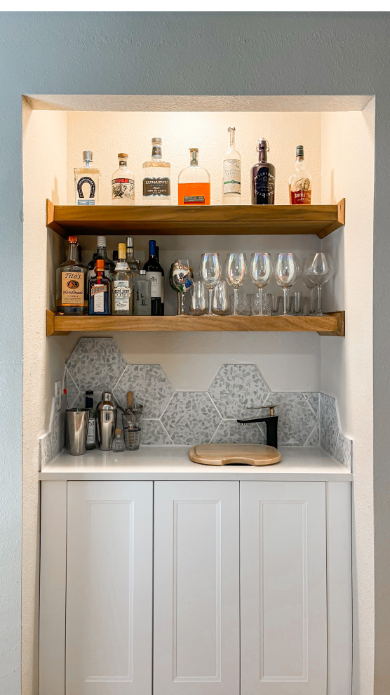 Photo of a small scandi single-wall home bar in Austin with a submerged sink, shaker cabinets, white cabinets, engineered stone countertops, green splashback, porcelain splashback and white worktops.