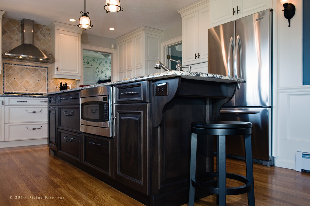 Inspiration for a traditional kitchen in Boston with stainless steel appliances and granite benchtops.