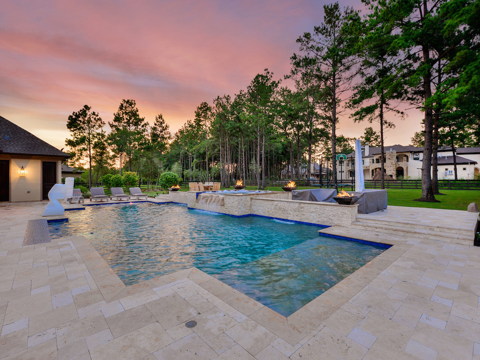 Inspiration for a large transitional backyard stone and rectangular natural hot tub remodel in Houston