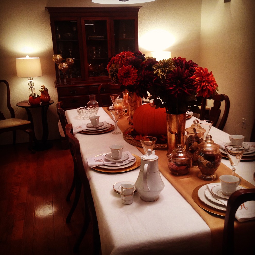 Enclosed dining room - large eclectic medium tone wood floor enclosed dining room idea with beige walls