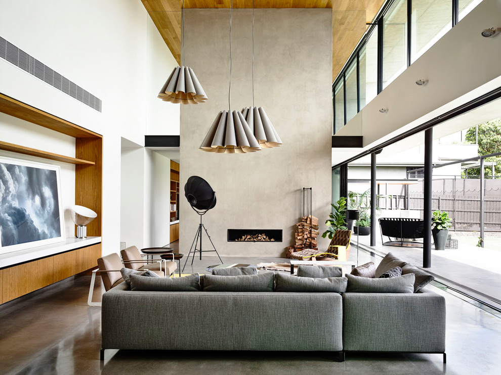 Design ideas for a modern formal open concept living room in Melbourne with white walls, a concrete fireplace surround, grey floor, concrete floors and a ribbon fireplace.