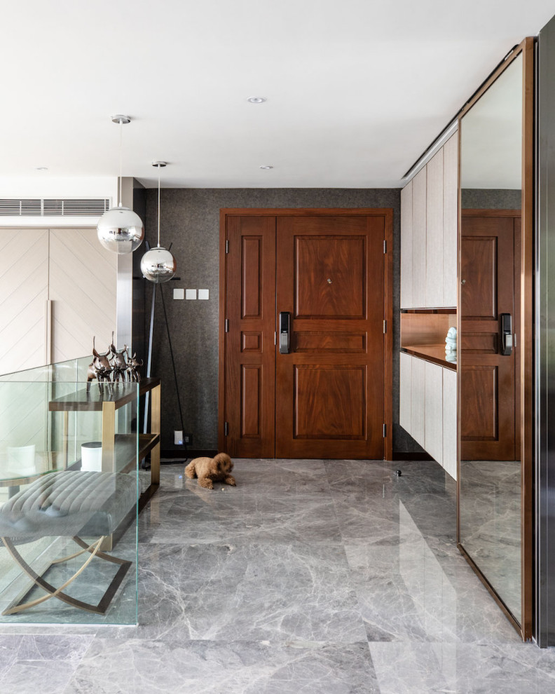Inspiration for a mid-sized contemporary foyer in Hong Kong with grey walls, marble floors, a double front door, a dark wood front door and grey floor.