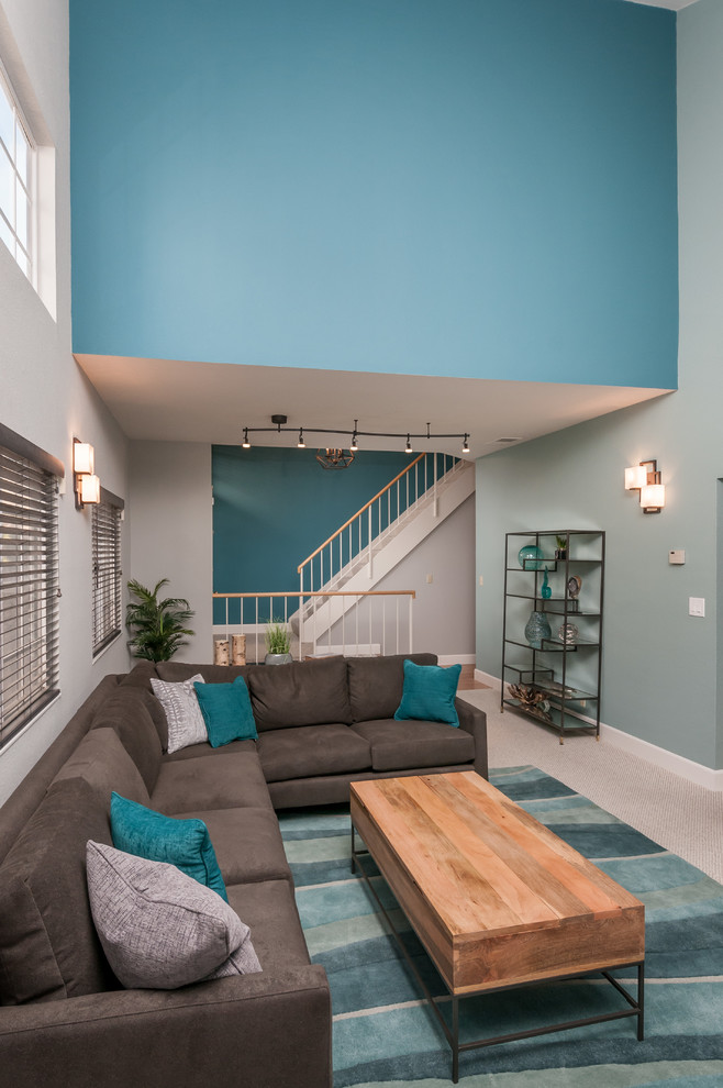 Mid-sized trendy open concept carpeted living room photo in San Francisco with blue walls, a standard fireplace and a tile fireplace