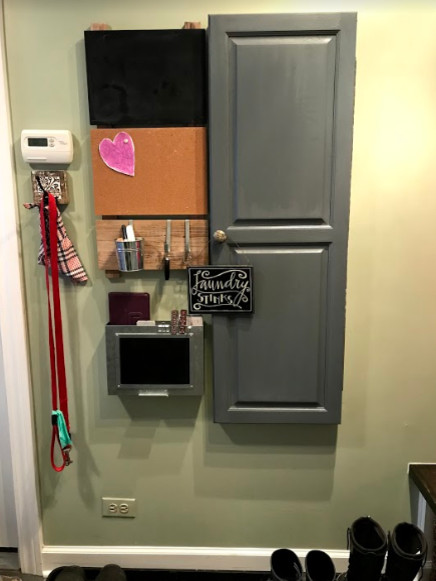Example of a small transitional porcelain tile and beige floor mudroom design with green walls