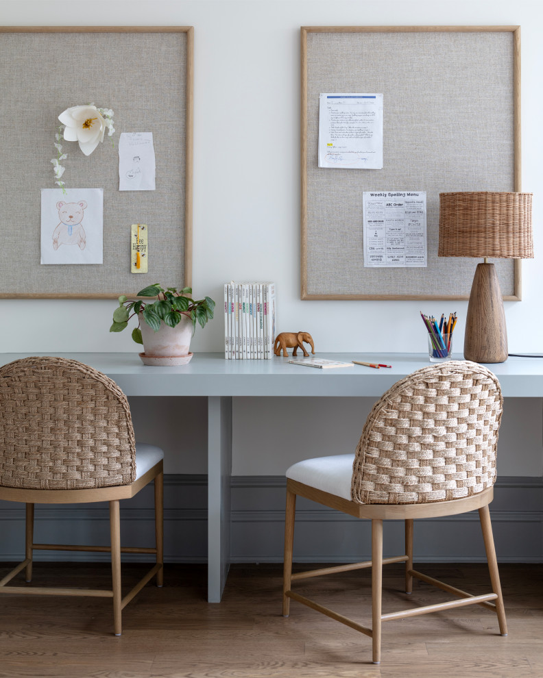 Rosemary at Chevy Chase - Example of a study space beach style gender-neutral medium tone wood floor and brown floor kids' study room design in DC Metro with white walls