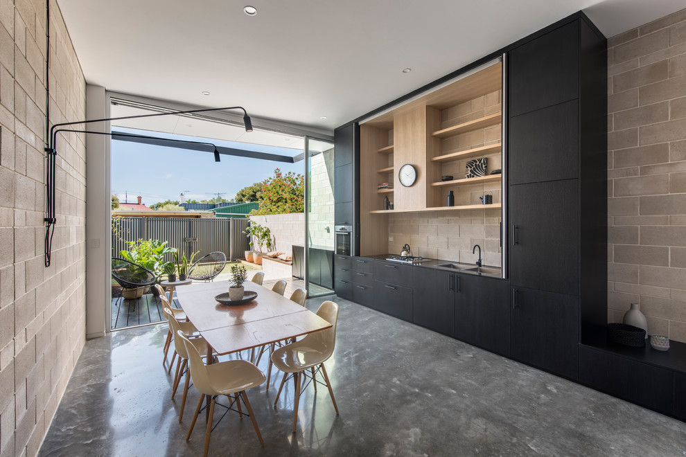 Design ideas for a small contemporary open plan dining in Adelaide with concrete floors.