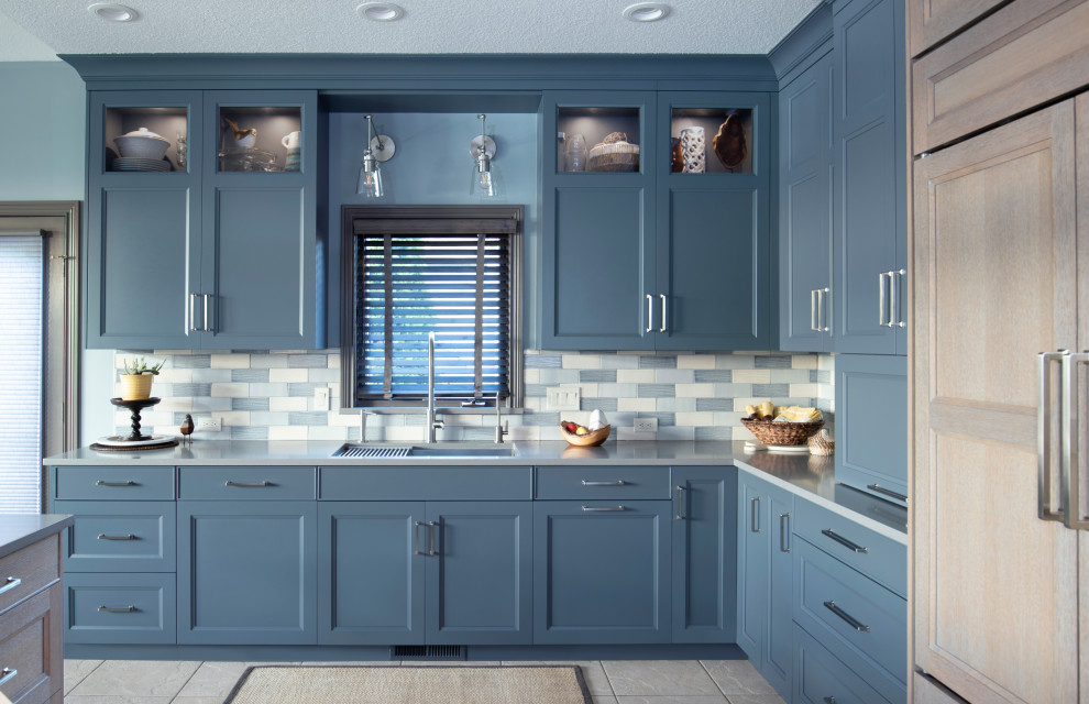 Eat-in kitchen - large transitional l-shaped eat-in kitchen idea in New York with an undermount sink, flat-panel cabinets, quartz countertops, multicolored backsplash, paneled appliances, an island, gray countertops and ceramic backsplash