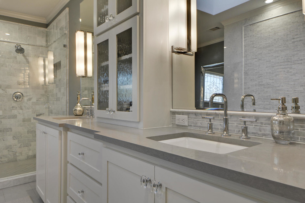 Freestanding bathtub - large transitional master gray tile and stone tile porcelain tile freestanding bathtub idea in Austin with shaker cabinets, white cabinets, a one-piece toilet, gray walls, quartzite countertops and an undermount sink
