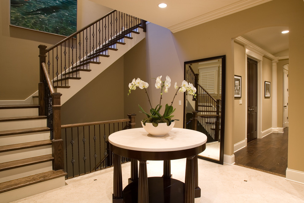 This is an example of a traditional wood l-shaped staircase in Chicago with painted wood risers.