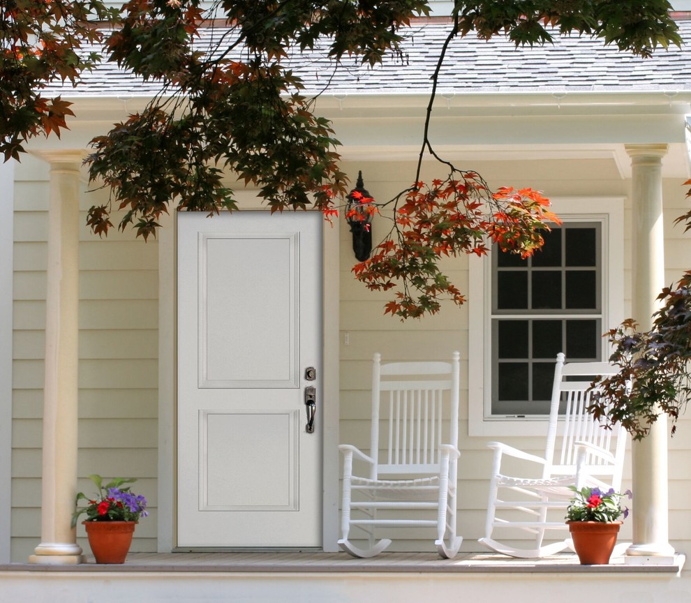 Photo of a mid-sized country front door in Vancouver with a single front door and a white front door.