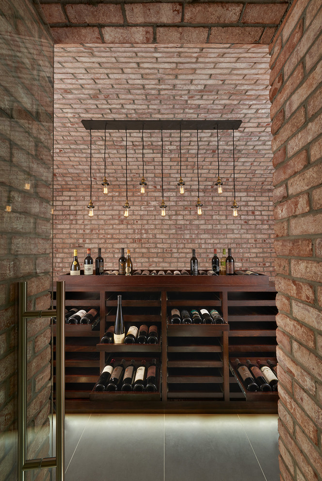 This is an example of a mid-sized industrial wine cellar in DC Metro with display racks.