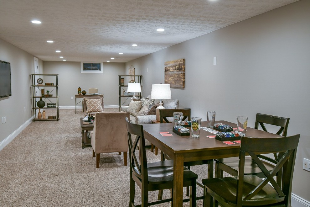 Photo of a large country fully buried basement in Columbus with grey walls, carpet and beige floor.