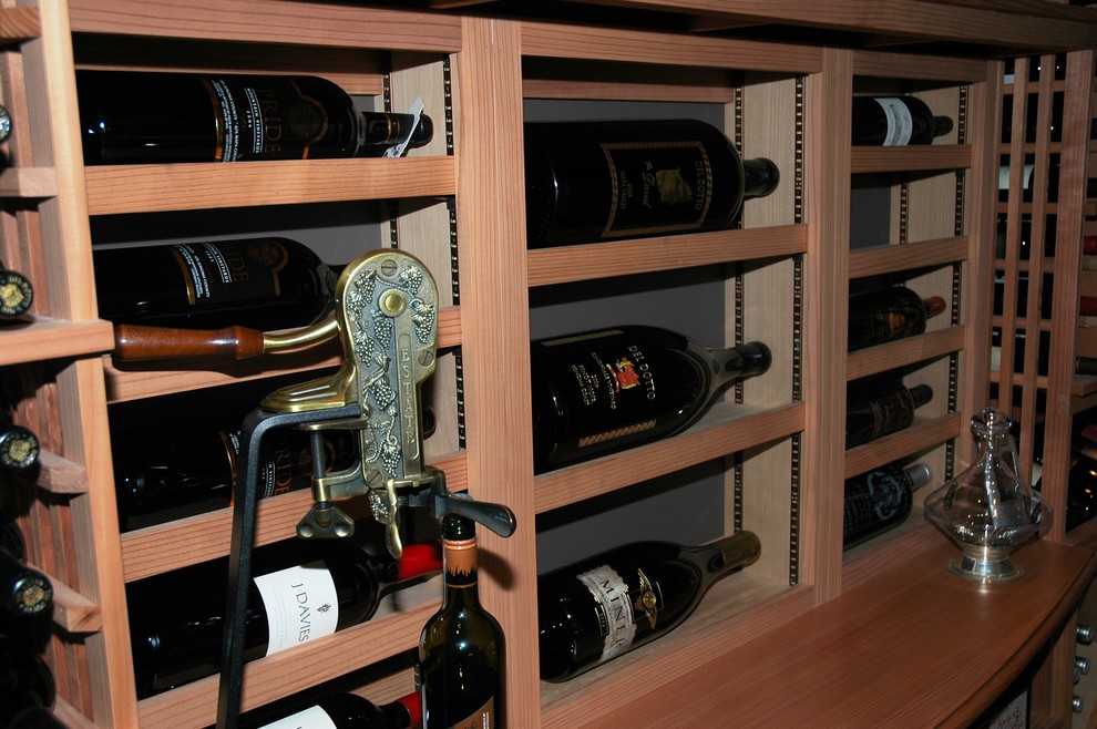 Design ideas for a mid-sized country wine cellar in San Diego with display racks.