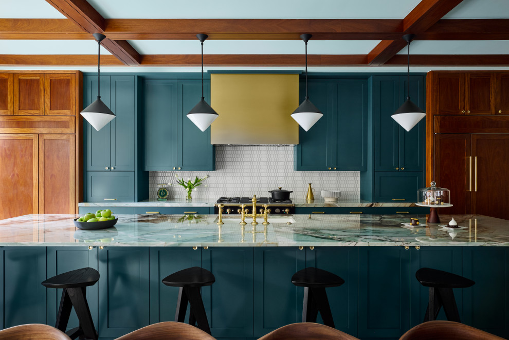 Contemporary galley kitchen in Chicago with a submerged sink, shaker cabinets, turquoise cabinets, white splashback, mosaic tiled splashback, black appliances, an island, white worktops and exposed beams.