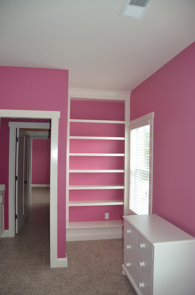 Mid-sized contemporary guest bedroom in Atlanta with pink walls, carpet, no fireplace and beige floor.