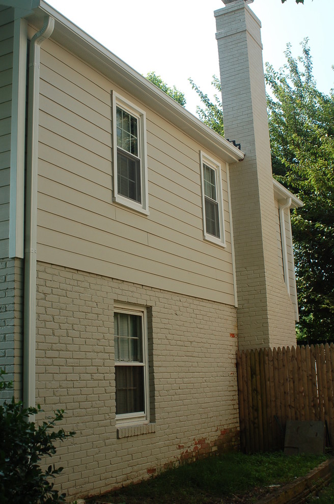 Large traditional two-storey exterior in DC Metro with concrete fiberboard siding and a gable roof.