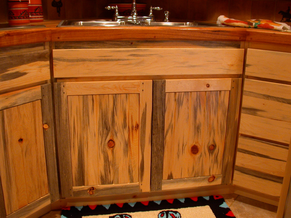 Home design - mid-sized rustic l-shaped ceramic tile home design idea in Phoenix with a double-bowl sink, shaker cabinets, light wood cabinets, wood countertops, brown backsplash, ceramic backsplash, stainless steel appliances and a peninsula