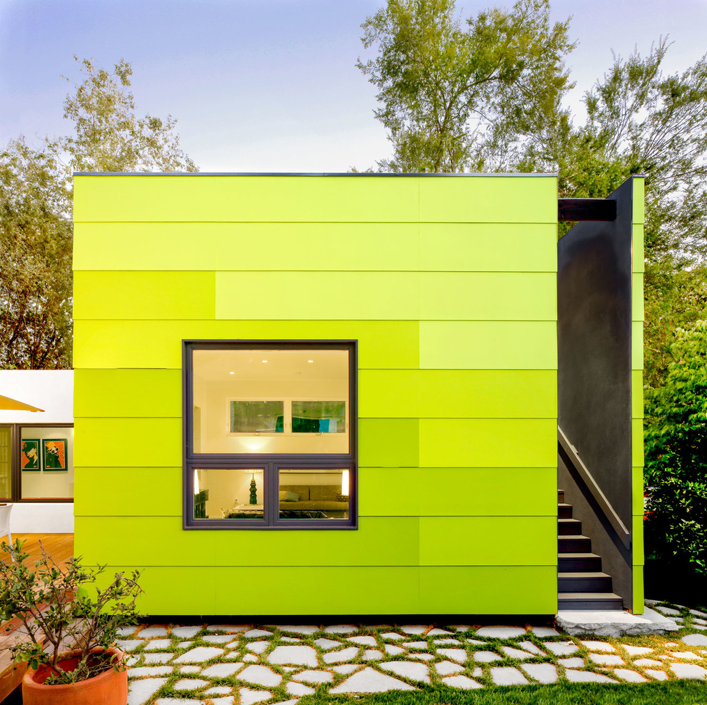 Inspiration for a contemporary green exterior in Los Angeles with a flat roof.