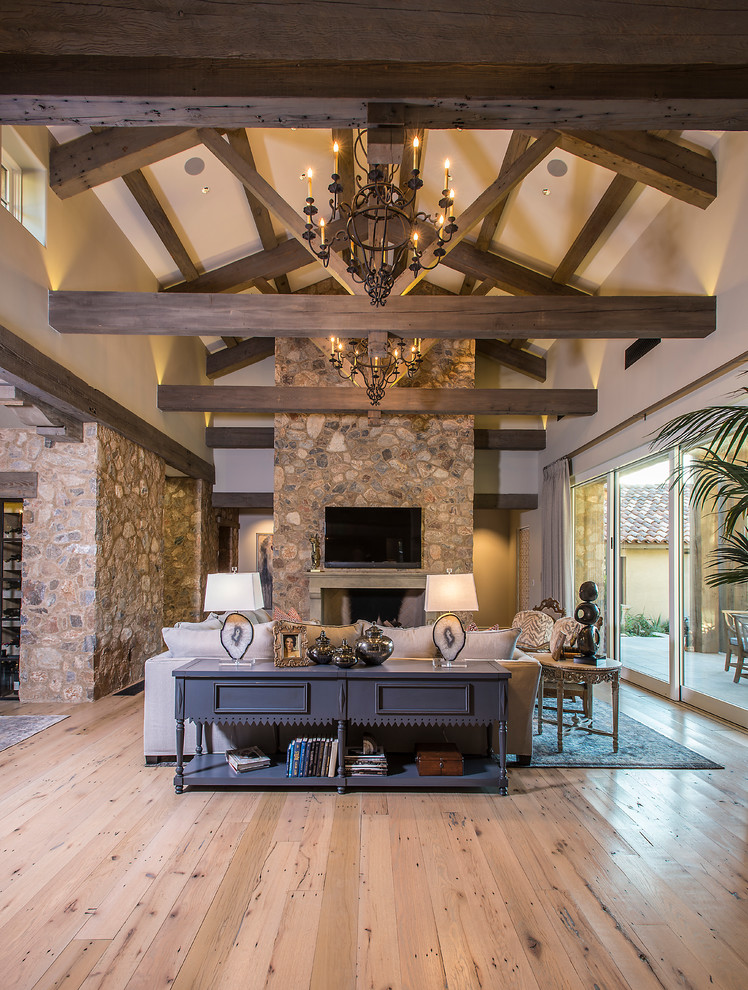 Living room - large transitional formal and enclosed light wood floor living room idea in Phoenix with beige walls, a standard fireplace, a stone fireplace and a wall-mounted tv