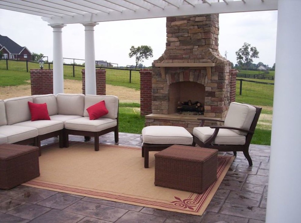 Example of a mid-sized transitional backyard patio design with a fire pit and a pergola