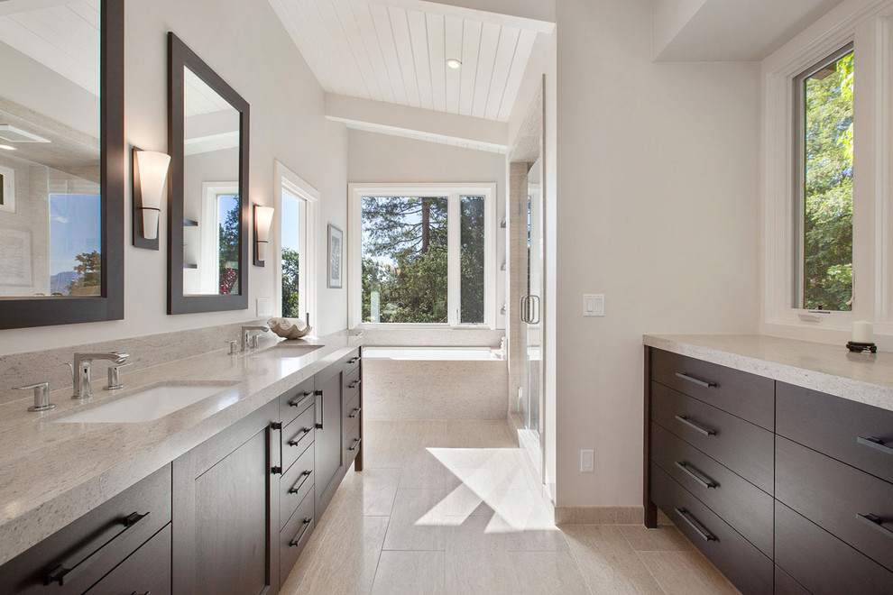 Large contemporary master bathroom in San Francisco with an undermount sink, recessed-panel cabinets, medium wood cabinets, a drop-in tub, an alcove shower, a one-piece toilet and white walls.