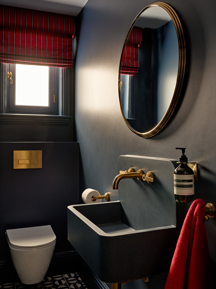 Design ideas for a large transitional powder room in London.
