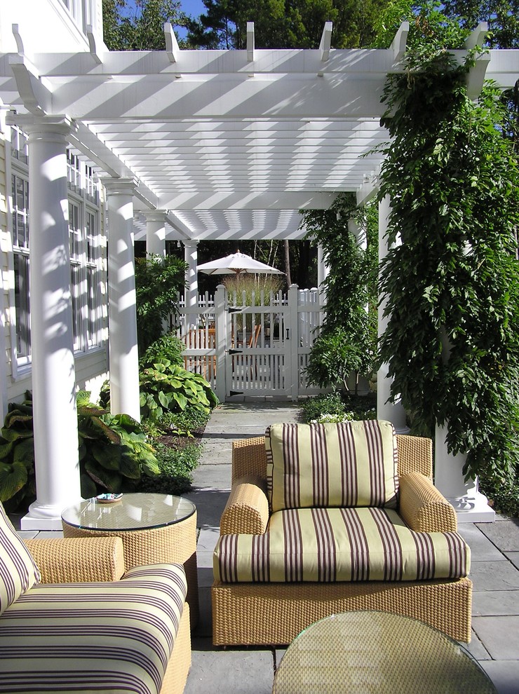 Inspiration for a traditional patio in Manchester with a pergola.