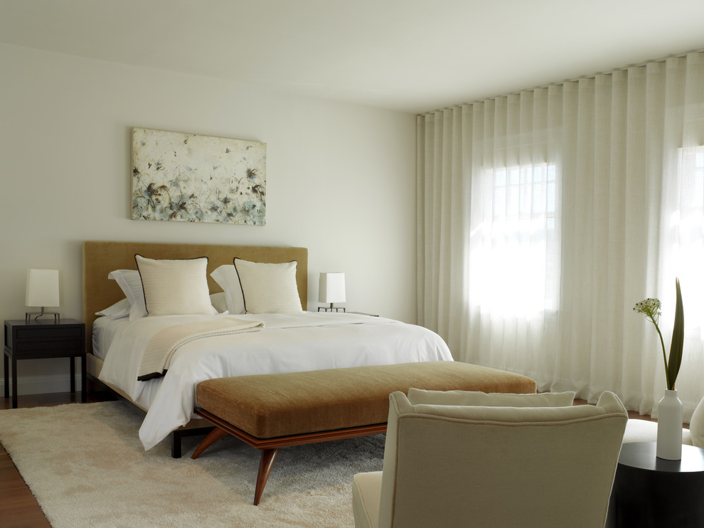 Inspiration for a contemporary bedroom in San Francisco with white walls, medium hardwood floors and no fireplace.