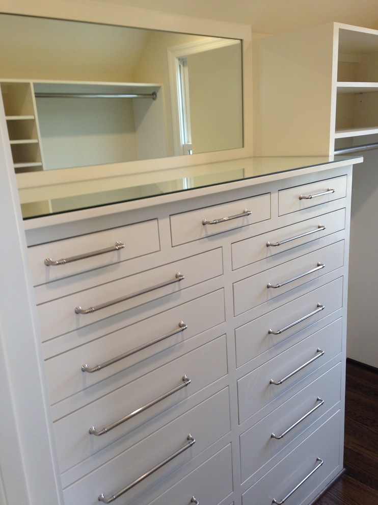 Design ideas for a large transitional gender-neutral dressing room in Nashville with flat-panel cabinets, white cabinets and medium hardwood floors.