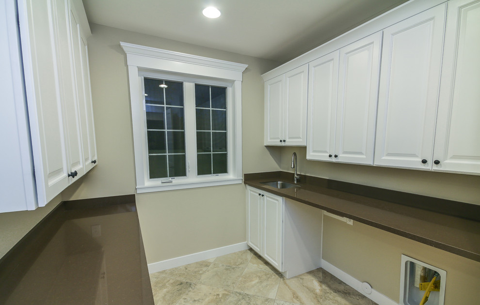 Example of a transitional laundry room design in Phoenix