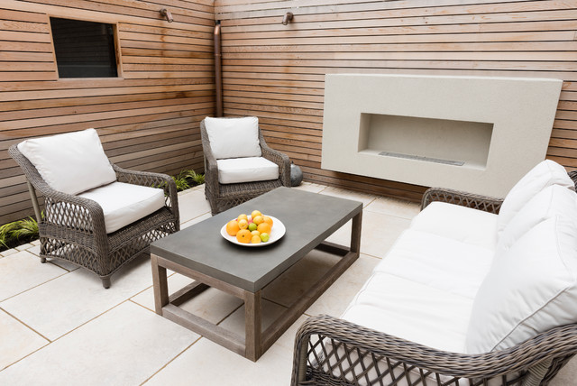 Secluded garden with Fireplace contemporary-courtyard