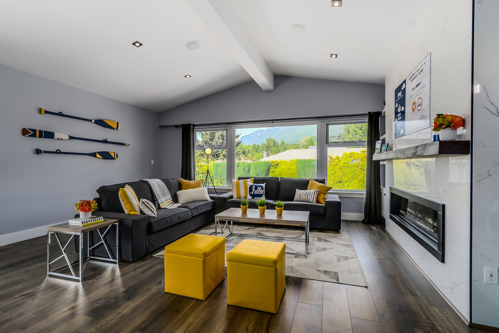 Photo of a mid-sized contemporary open concept living room in Vancouver with grey walls, light hardwood floors, a ribbon fireplace, a tile fireplace surround and a wall-mounted tv.