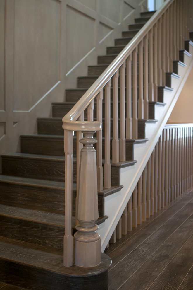 This is an example of a traditional wood straight staircase in Los Angeles with wood risers and wood railing.